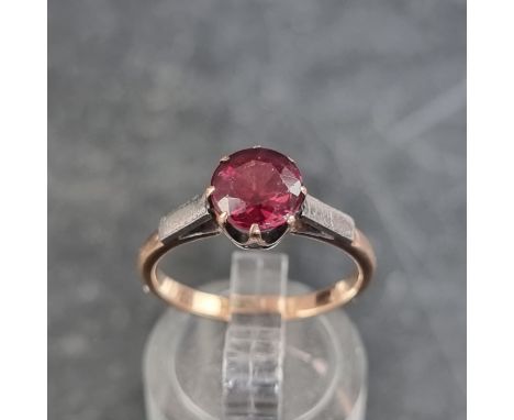 A yellow metal ruby ring,&nbsp;stamped 9ct. size M. 