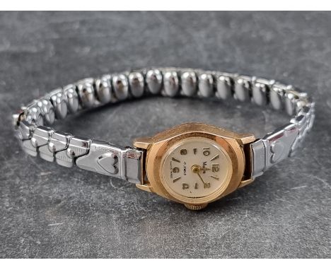 A MuDu 18ct gold manual wind ladies wristwatch, 16mm, on later expanding bracelet. 
