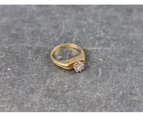 An 18ct gold illusion set diamond solitaire ring,&nbsp;approximately 0.08ct, London 1975, size K 1/2, gross weight 3.1g. 