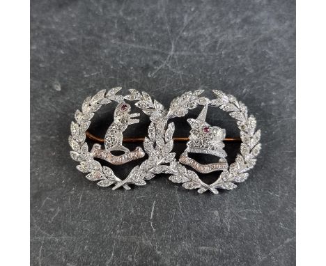 A white metal diamond and ruby 'Argyll &amp; Sutherland Highlanders' sweetheart brooch, 51mm wide. 