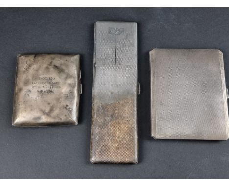 An engine turned silver cigarette case, by&nbsp;I S Greenberg &amp; Co, Birmingham 1933, 16.5cm wide; together with two other