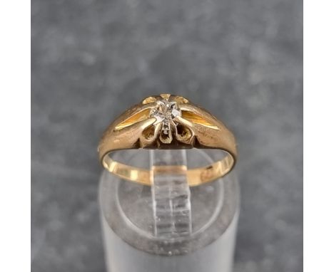 A yellow metal diamond set gypsy ring. 