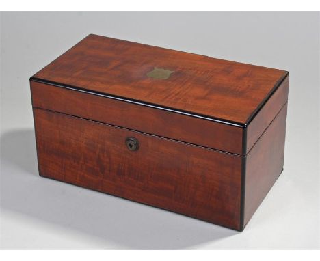 Victorian mahogany tea caddy. The rectangular top with brass shield inlaid with a Bramar lock, a pair of hinged lidded compar