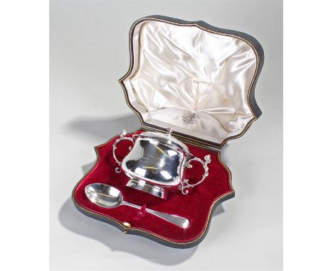 George V silver cased twin handled cup and spoon, London 1917,Goldsmiths and Silversmiths company. The spoon, 1916, the lidde