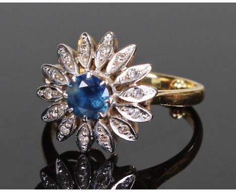 18 carat gold diamond and sapphire ring, the central sapphire with diamond set leaf surround, ring size L