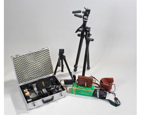 Nikon FG 35mm camera together with a Voigtlander camera, a Canon camera, two stands and further accessories (qty)