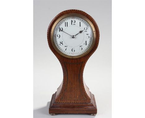 Early 20th Century oak and chequer strung balloon clock, the balloon case with a white enamel dial, single train French movem