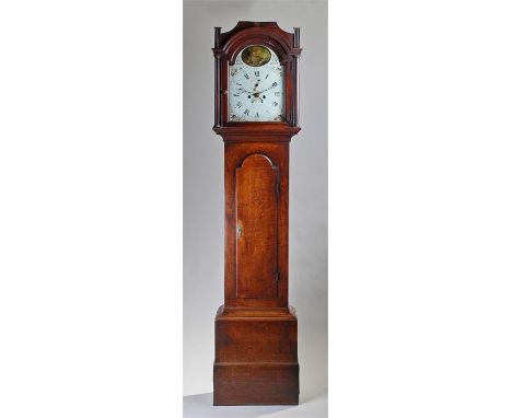 18th Century oak longcase clock Ipswich. The hood with an arched glazed door, turned columns and long trunk door, plinth base