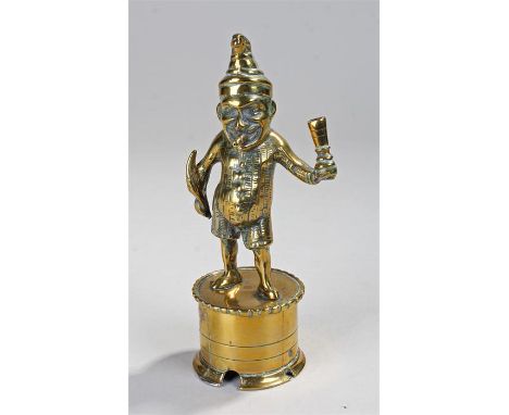 Victorian brass "Mr Punch" bar lighter with hole through the cigar in Mr Punch's mouth and fixings to attach it to the bar, h