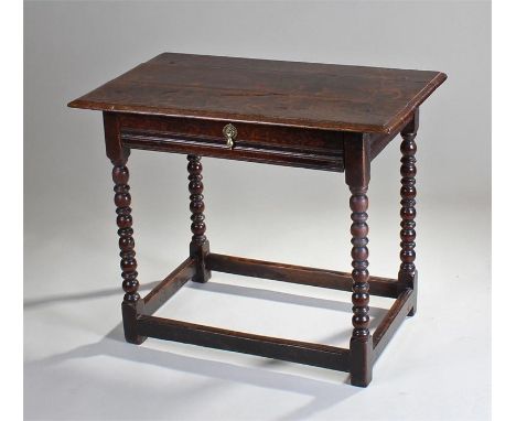 18th Century oak side table, the rectangular top with a frieze drawer, bobbin turned legs untied by stretchers and  82cm wide