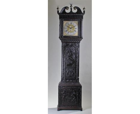 George III later carved oak longcase clock, R Midgley, Halifax. The swan neck pediment surmounted by an eagle above a square 