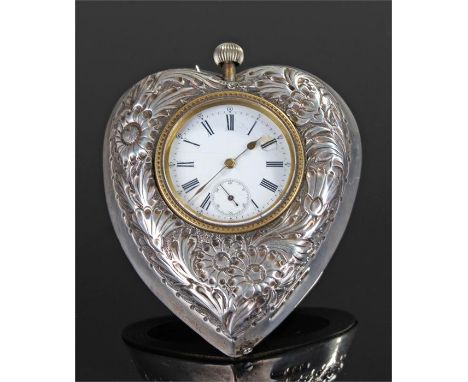 Victorian silver heart shaped travelling clock, Birmingham 1896, the foliate embossed case with a white enamel dial with blac