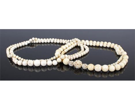 Two sets of early 20th Century Chinese ivory and bone beads. The first with carved foliate beads then tapering spheres, 90cm 