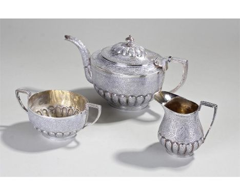Delhi Durbar 1911 interest, an Indian white metal three piece tea service, with a teapot, milk jug and sugar basin, with intr