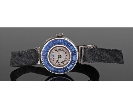 Silver and enamel ladies wristwatch, the outer blue enamel case with a silvered dial having Roman hours, manual wound, case 2