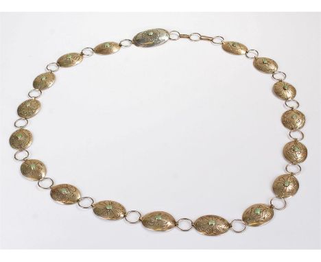 Sterling silver Art Nouveau style belt, with a row of engraved oval plaques with central oval jade stones applied to the cent