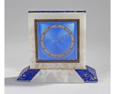 Fine Art Deco alabaster lapis lazuli and guilloche enamel mantel clock. The square alabaster case with canted lapis lazuli ed