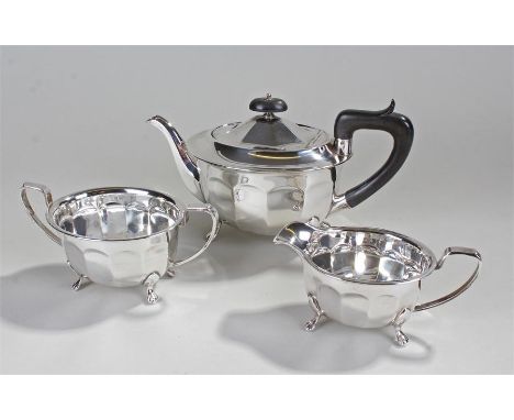 Elizabeth II Silver three piece tea set, Sheffield 1956, Edward Viner. The tea pot on paw feet with wooden handle, 14cm high,