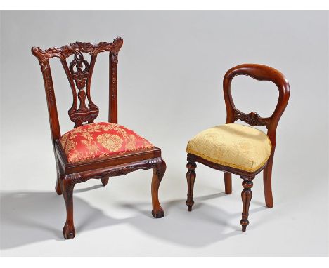Two miniature mahogany chairs. The first in the Chippendale taste, 54cm high and a Victorian balloon back chair, 47cm high (2
