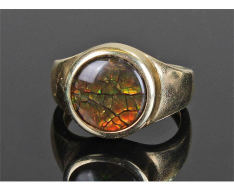 14 carat opal set ring, the opal disc to the centre with wide shoulders, ring size K