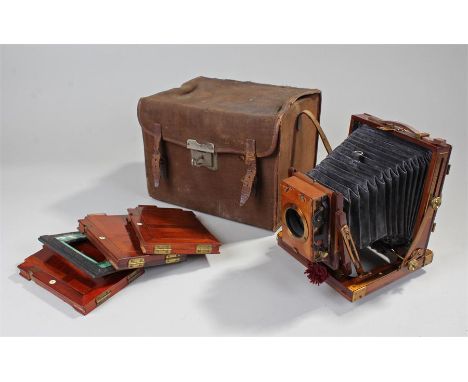 The National Camera half plate camera, together with three numbered half plates and a lens