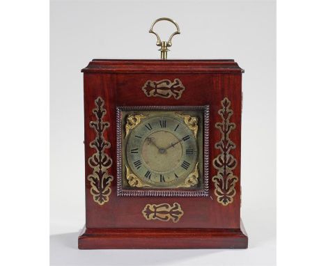 Late 19th Century mahogany and brass inlaid mantel clock. The stepped top with brass handle above a brass inlaid case, gadroo