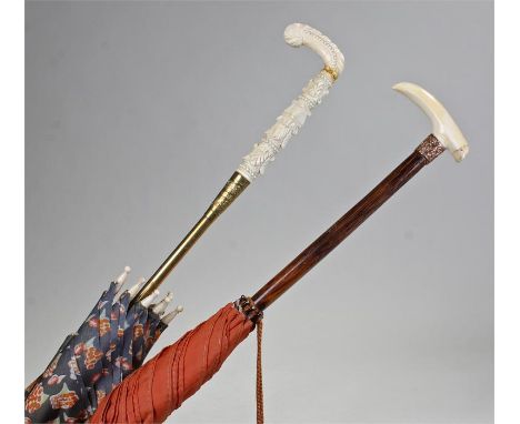 Two Victorian parasols, the first with a carved ivory handle, the second with a tuck, (2)