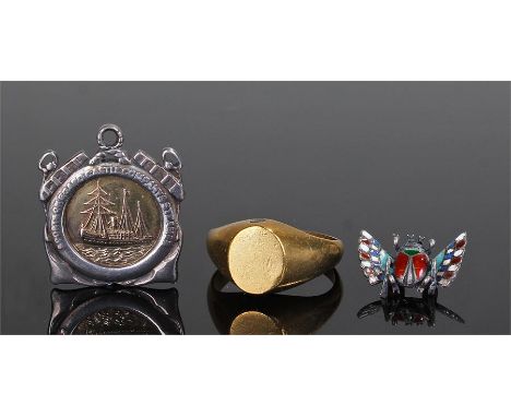 Unusual Stanhope ring with erotic scene, together with a white metal and enamel Egyptian scarab beetle and a silver and 9 car