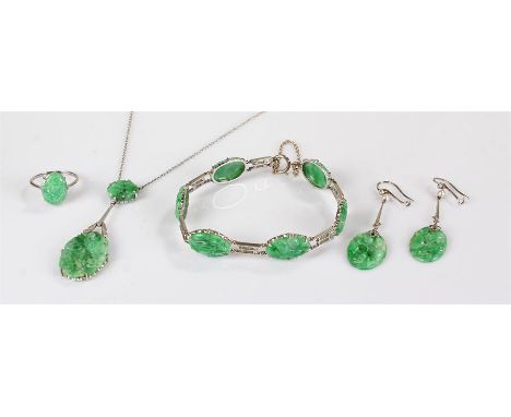 9 carat white gold and jade jewellery set to include a ring, earrings, necklace and bracelet, each with foliate carved green 