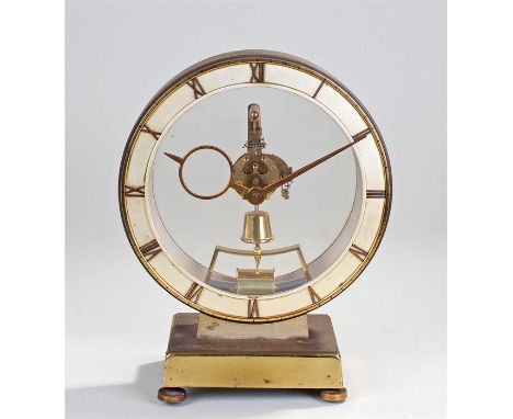 Kundo mantel clock, Keninger and Obergfell. The circular white chapter ring with glass centre showing the movement, raised on