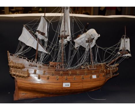 English School (20th Century)Three Masted Galleon Under Constructionunsigned, oil on fabric panel, 51cm x 62cm; A wooden mode