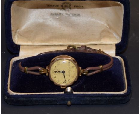 A vintage Thomas Russell & sons 9ct gold cased lady's wristwatch, cream dial, Arabic numerals, minute track, manual wind Swis