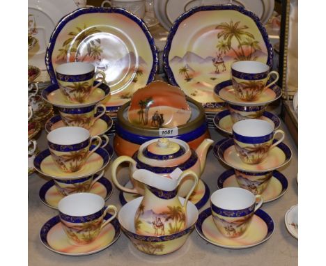 A Victoria China Desert Scene tea service, to include 12 cups, saucers, plates, teapot and stand, jug, fruit bowl; etc.