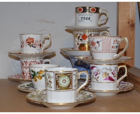 A Royal Crown Derby harlequin set of cups and saucers, a Blue Aves teacup and saucer, other coffee cans and saucers comprisin