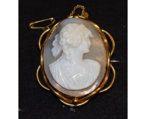 A Victorian 9ct gold mounted carved shell cameo brooch, portrait of a classical maiden, writhen overlapping 9ct gold frame, s