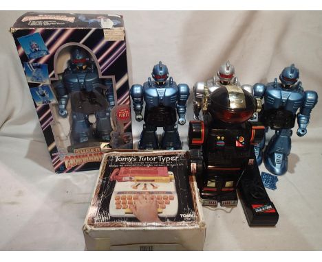 Boxed Super Commander robot, 3 unboxed, Universal Cosmic Cruiser Robot and another Remote Controlled robot. Items appear in V