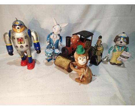 Six clockwork tin toys in working order to include a robot, traction engine, rabbit, horse &amp; jockey, dog and a monkey. UK