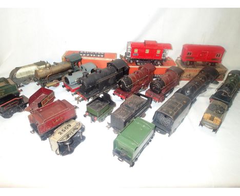 Large quantity of playworn and boxed O gauge, clockwork engines, rolling stock, track and trackside by Hornby, Marklin, Gilbe