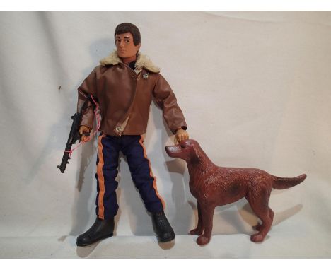 1964 Palitoy Action Man with boots, jumpsuit, jacket, rifle and dog, moving eyes, very good flocking, hands and feet intact. 