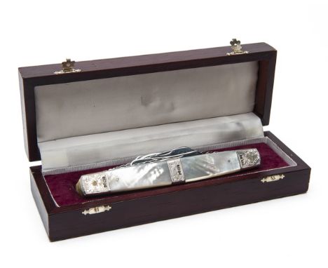 STAN SHAW, SHEFFIELDA MAGNIFICENT BOXED ELEVEN-FUNCTION SILVER-MOUNTED ENGRAVED EXHIBITION KNIFE, serial no. 009,with hallmar