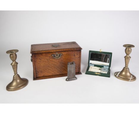 AN INTER WAR YEARS DUNHILL ENGINE TURNED WHITE METAL CASED CIGARETTE LIGHTER, together with an Edwardian oak fall front stati