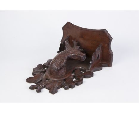 AN EARLY 20TH CENTURY BLACK FOREST CARVED LINDEN WOOD STAGS HEAD WALL BRACKET 