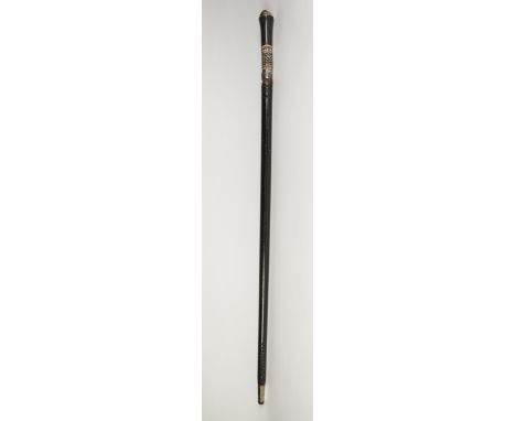 INDIAN EARLY TWENTIETH CENTURY CARVED EBONY AND BONE INLAID SWORD STICK, of typical form, having lions mask pommel, plated si