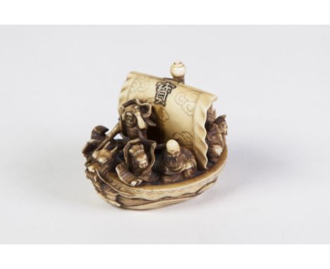 A VERY FINE JAPANESE MEIJI PERIOD CARVED IVORY NETSUKE  THE 7 GODS OF GOOD FORTUNE IN TREASURE SHIP, upon foaming waves, sign