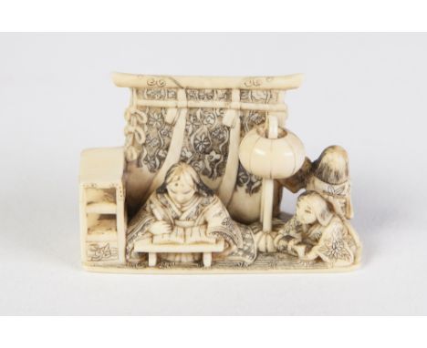 A GOOD JAPANESE MEIJI PERIOD CARVED IVORY NETSUKE, in the form of a kneeling scribe with two attendants  before a screen, sig