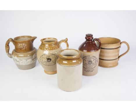 A 19TH CENTURY LARGE CAPACITY BUFF GLAZED EARTHENWARE MUG, horizontally branded in white and brown, also a 19th Century mould
