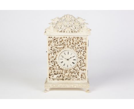 A LATE NINETEENTH  CENTURY CHINESE CANTON EXQUISITELY CARVED AND PIERCED IVORY CASED MANTEL CLOCK/CLOCK CASE, of shallow rect