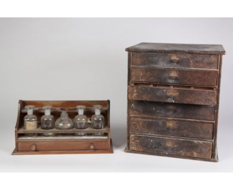 SMALL, EARLY 20th CENTURY STAINED WOOD CHEST OF SIX INTERNALLY DIVIDED SMALL DRAWERS containing some pocket watch parts and h