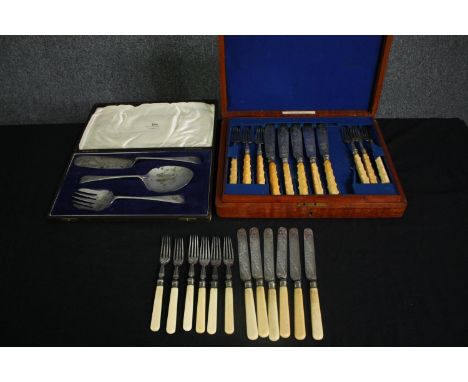 Two sets of silver plated cutlery with simulated horn handles, including a cased fish knife and fork set (one knife missing a