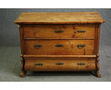 A 19th century French provincial pine commode. H.80 W.112 D.110cm. 